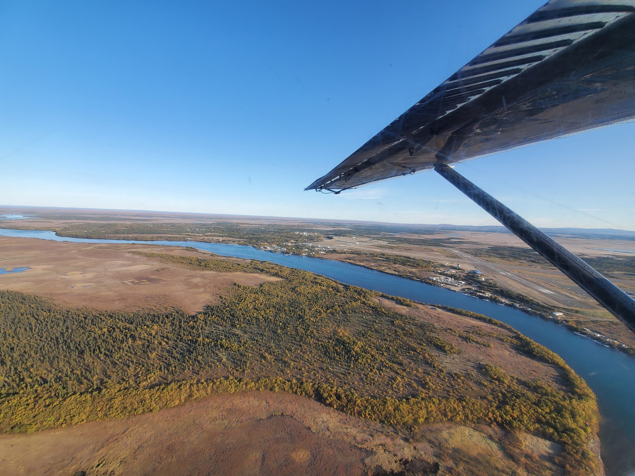 Aerial view of King Salmon and the Naknek River from a bush-plane window in fall